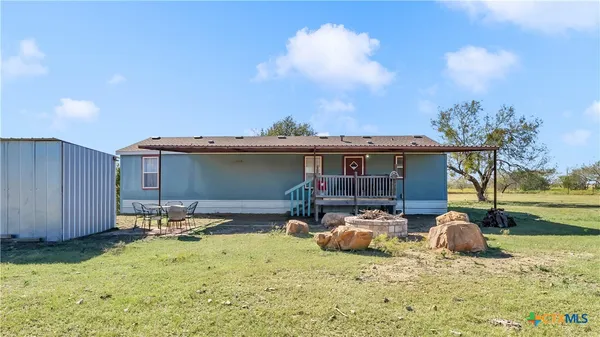 a house with trees in the background