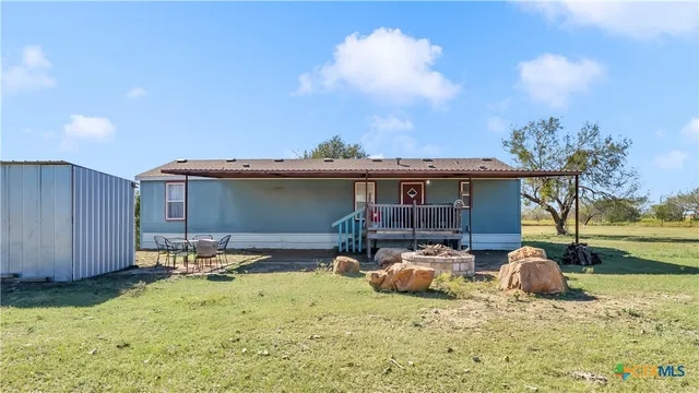 a house with trees in the background