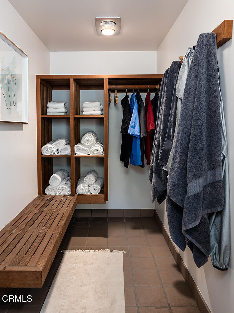 140 Belday Road Pasadena, CA 91105 - Photo 51 of 58 a view of walk in closet with clothes and shoes