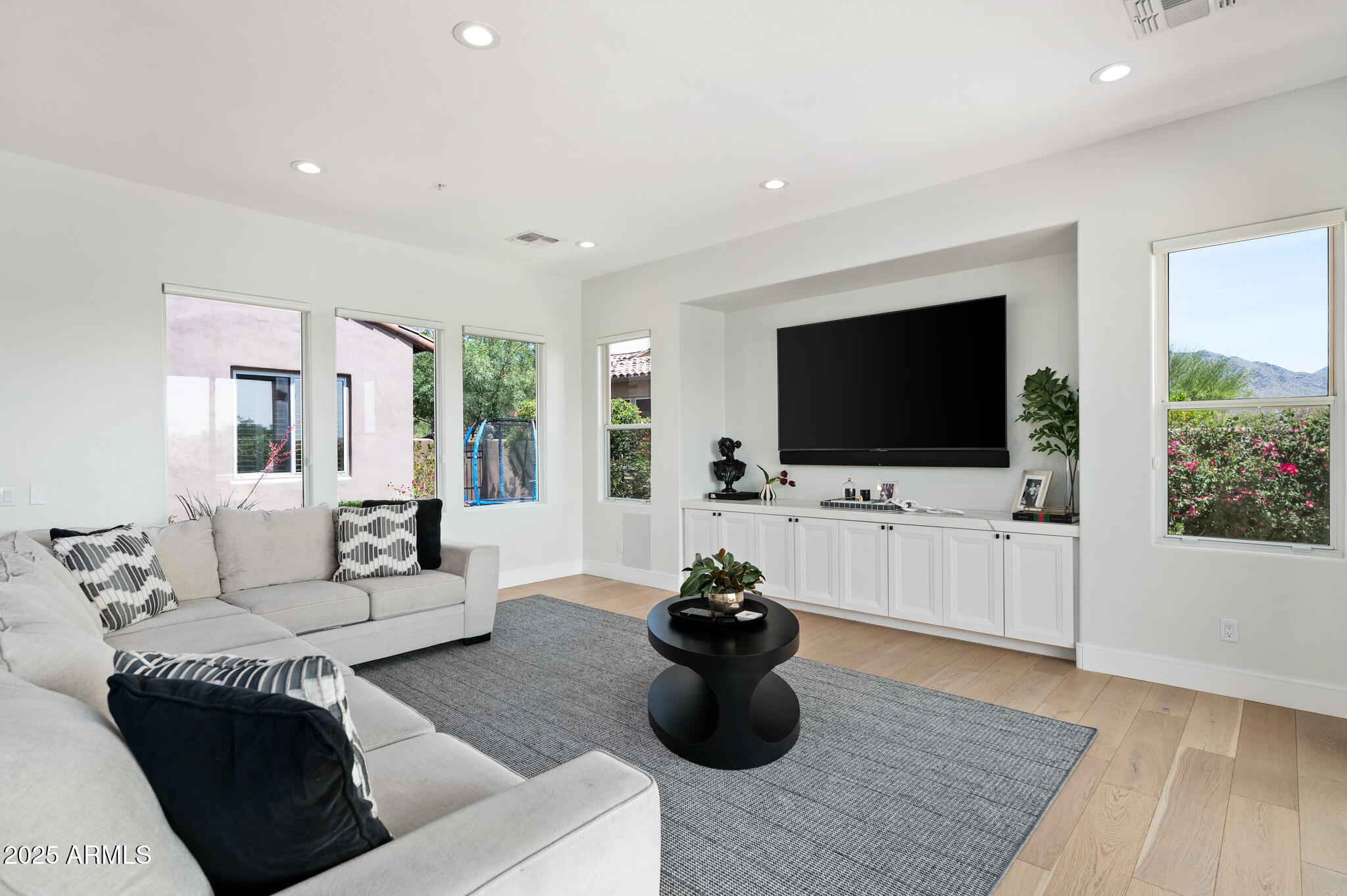 9631 East Mountain Spring Road Scottsdale, AZ 85255 - Photo 12 of 48 a living room with furniture and a flat screen tv