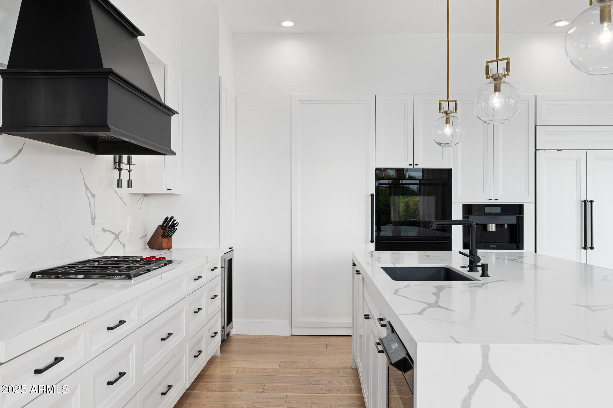 9631 East Mountain Spring Road Scottsdale, AZ 85255 - Photo 17 of 48 a kitchen with stainless steel appliances a stove a sink and a refrigerator