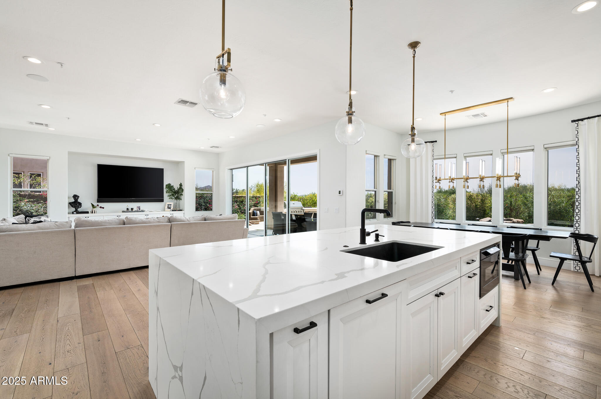9631 East Mountain Spring Road Scottsdale, AZ 85255 - Photo 18 of 48 a large white kitchen with a large island