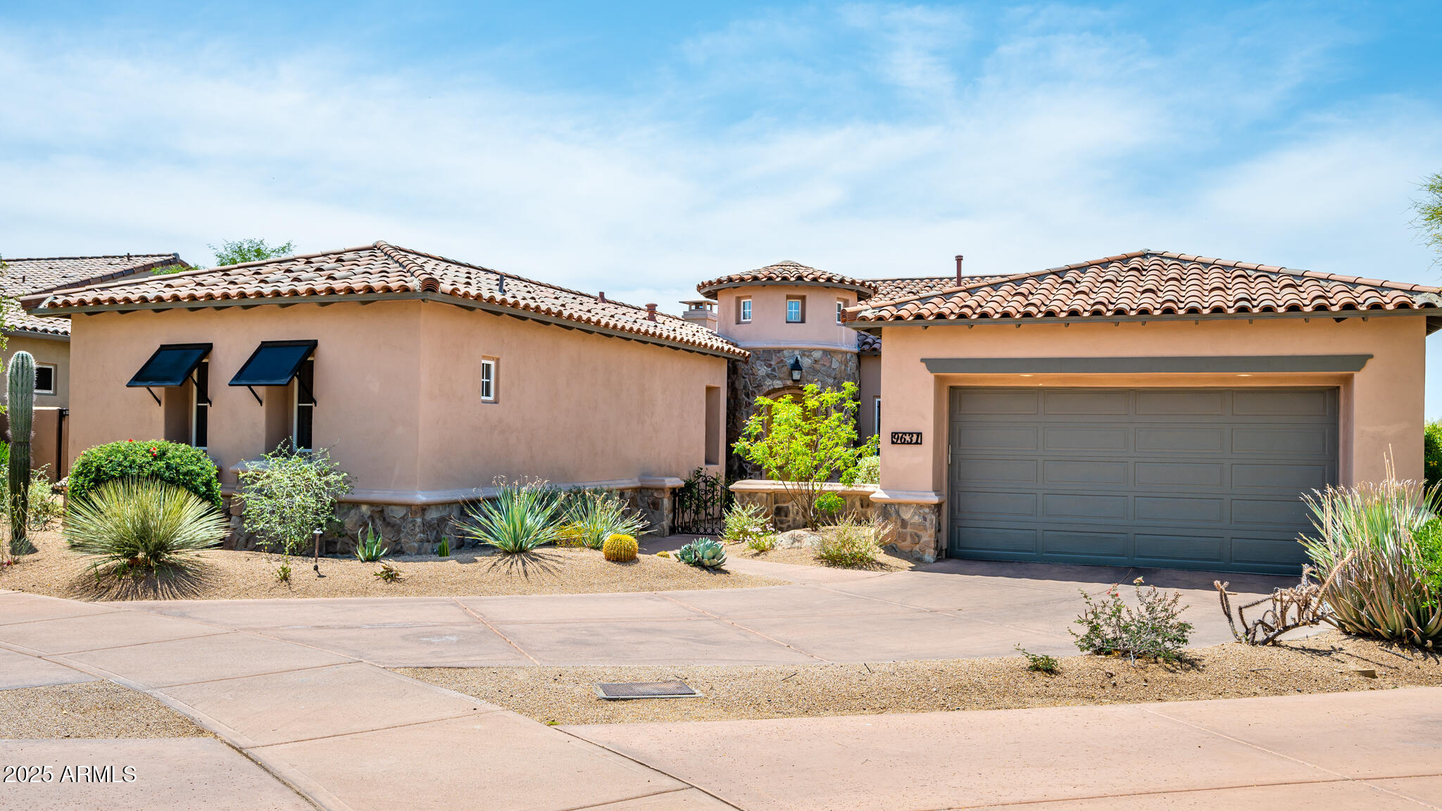 9631 East Mountain Spring Road Scottsdale, AZ 85255 - Photo 2 of 48 a front view of a house with a garage