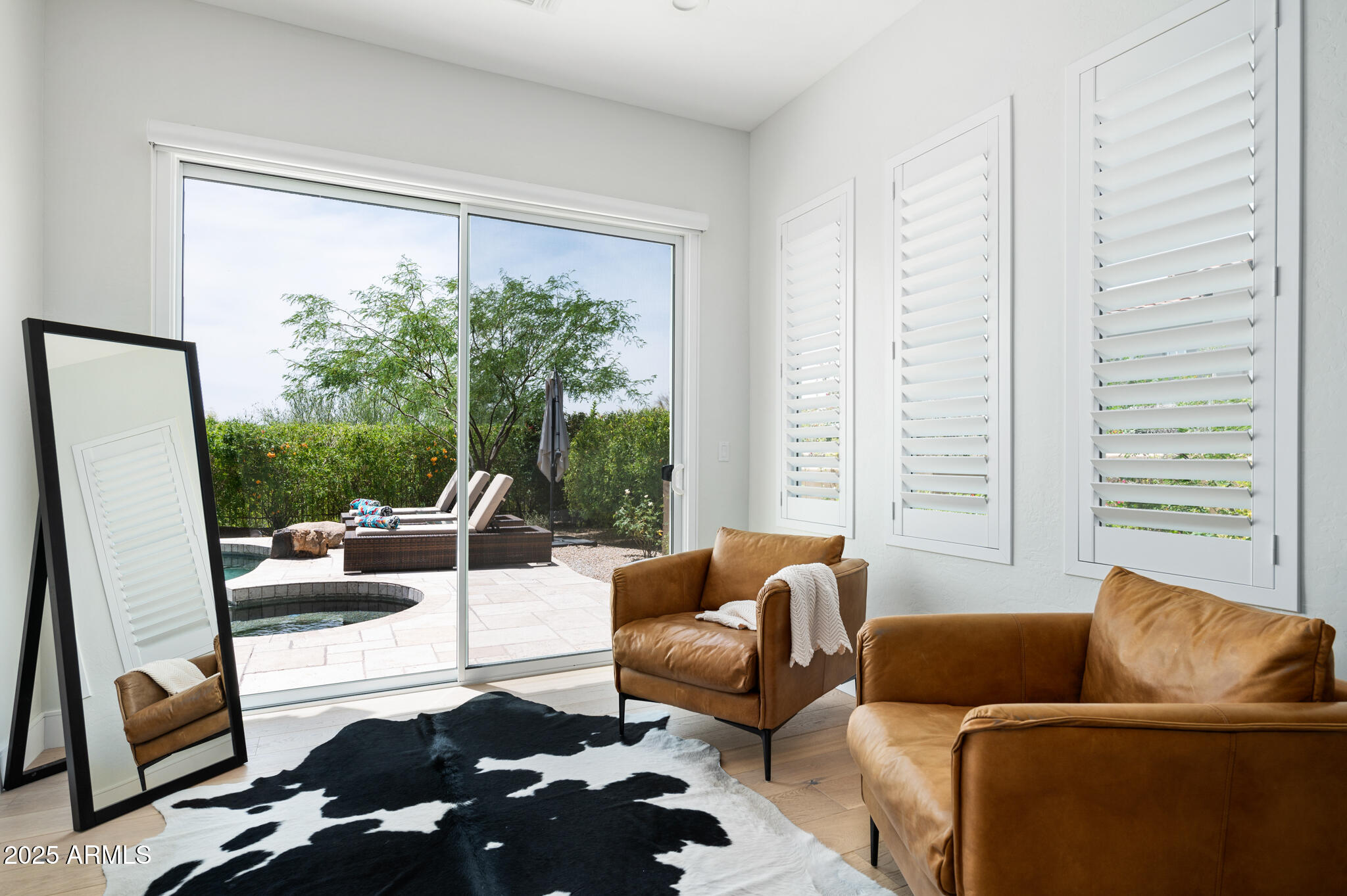 9631 East Mountain Spring Road Scottsdale, AZ 85255 - Photo 22 of 48 a living room with furniture and a large window
