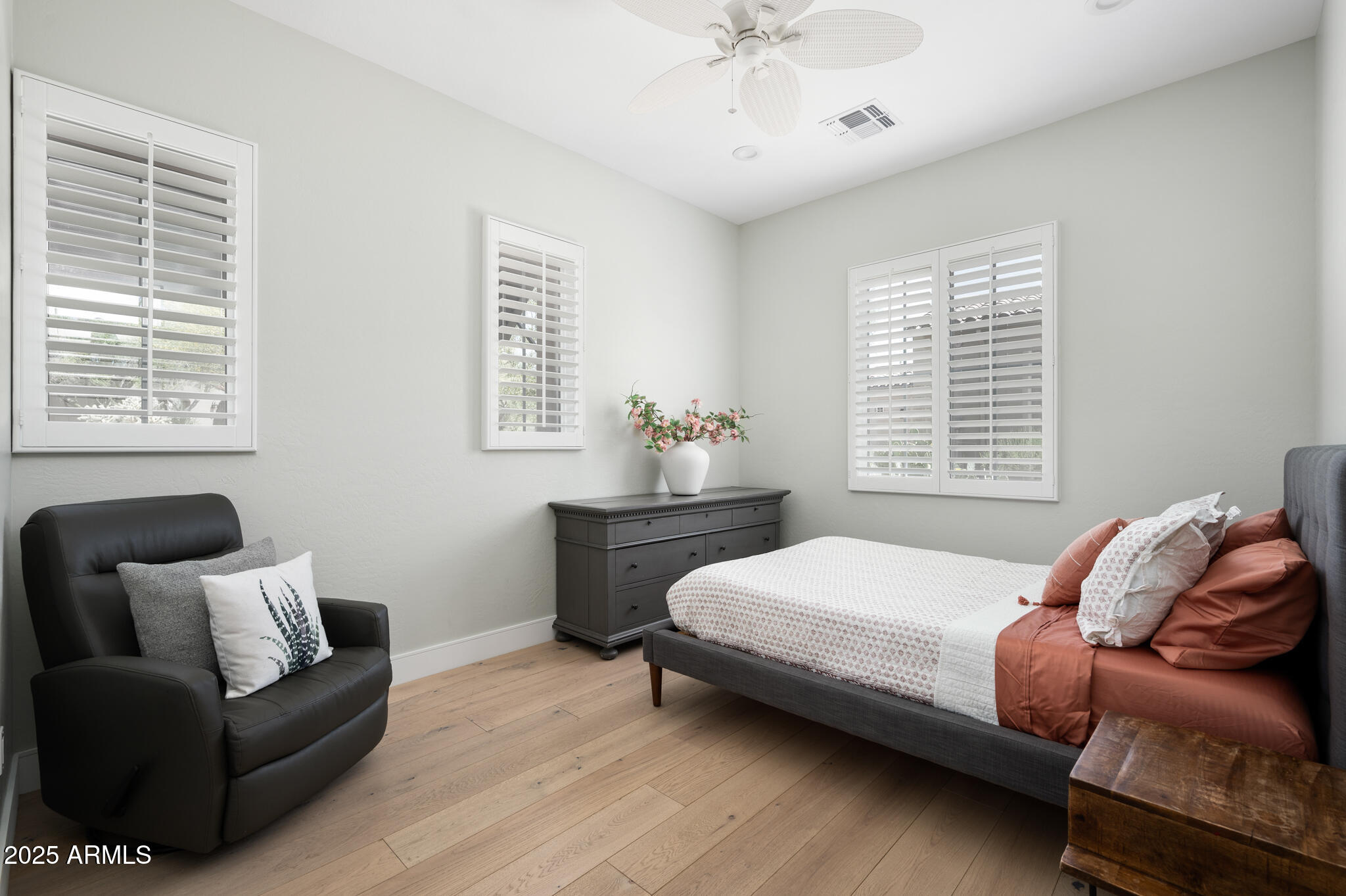 9631 East Mountain Spring Road Scottsdale, AZ 85255 - Photo 27 of 48 a bedroom with a bed and windows