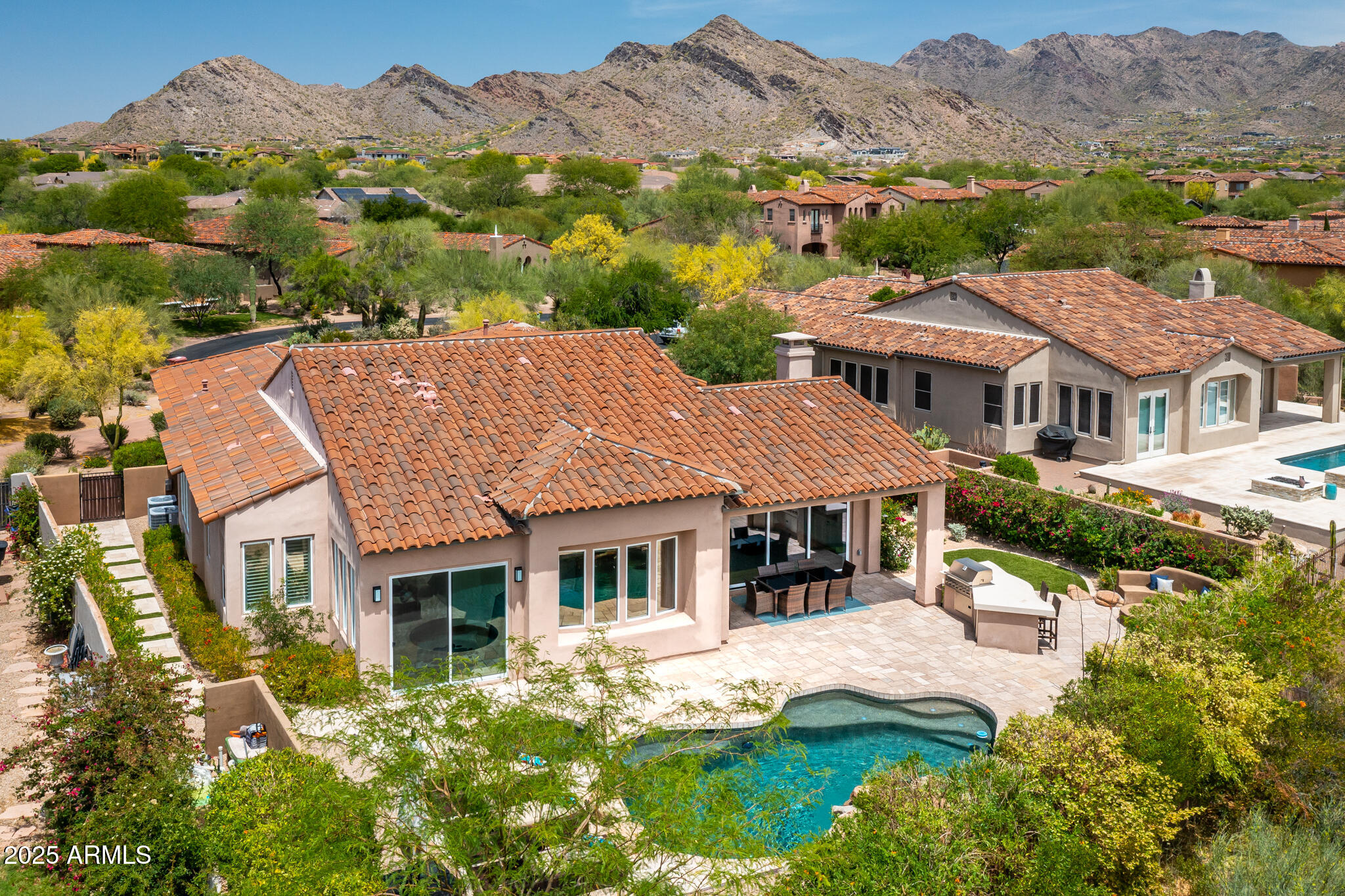 9631 East Mountain Spring Road Scottsdale, AZ 85255 - Photo 3 of 48 front view of a house with a yard
