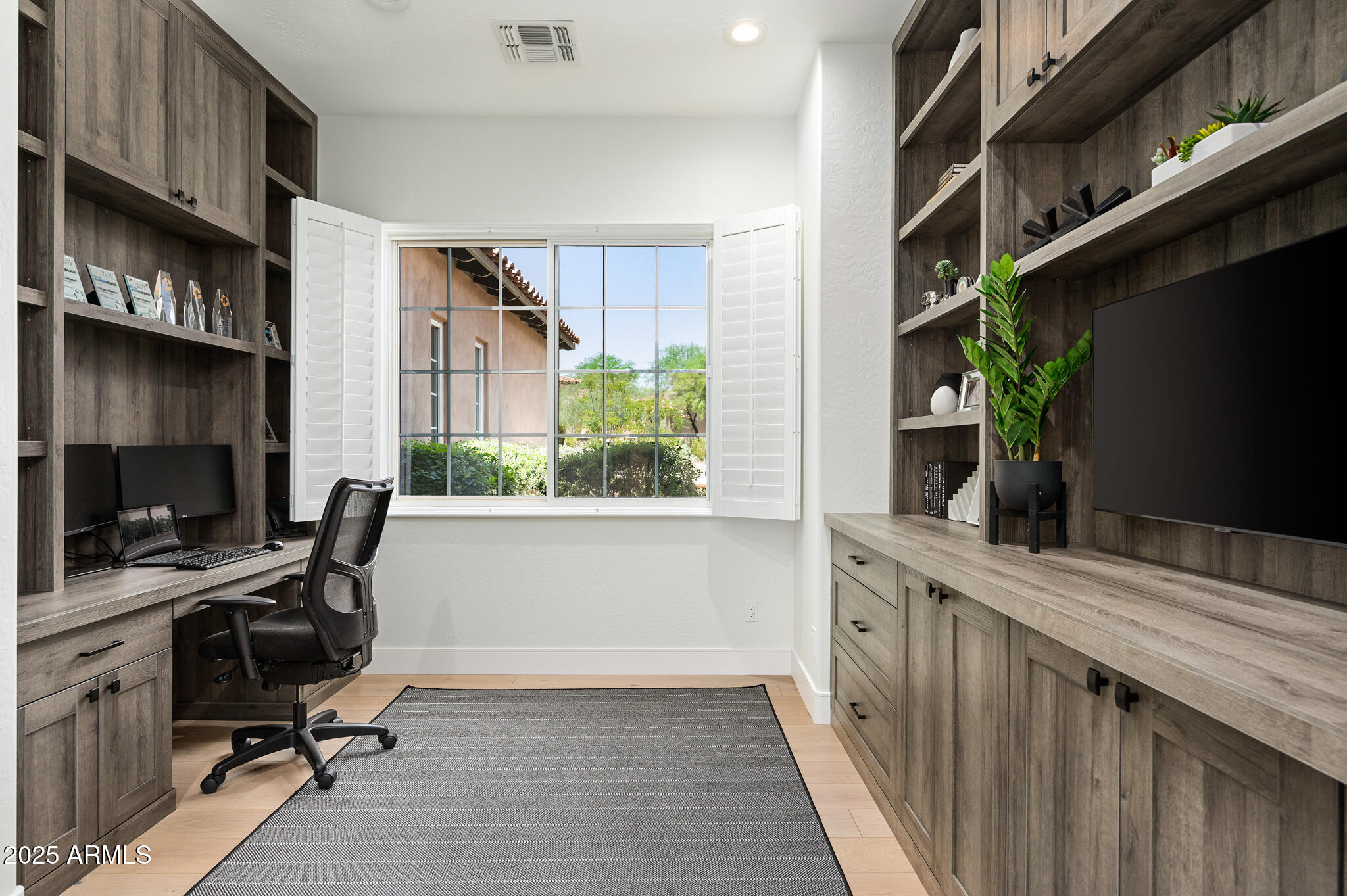 9631 East Mountain Spring Road Scottsdale, AZ 85255 - Photo 31 of 48 a view of a workspace with furniture and a window