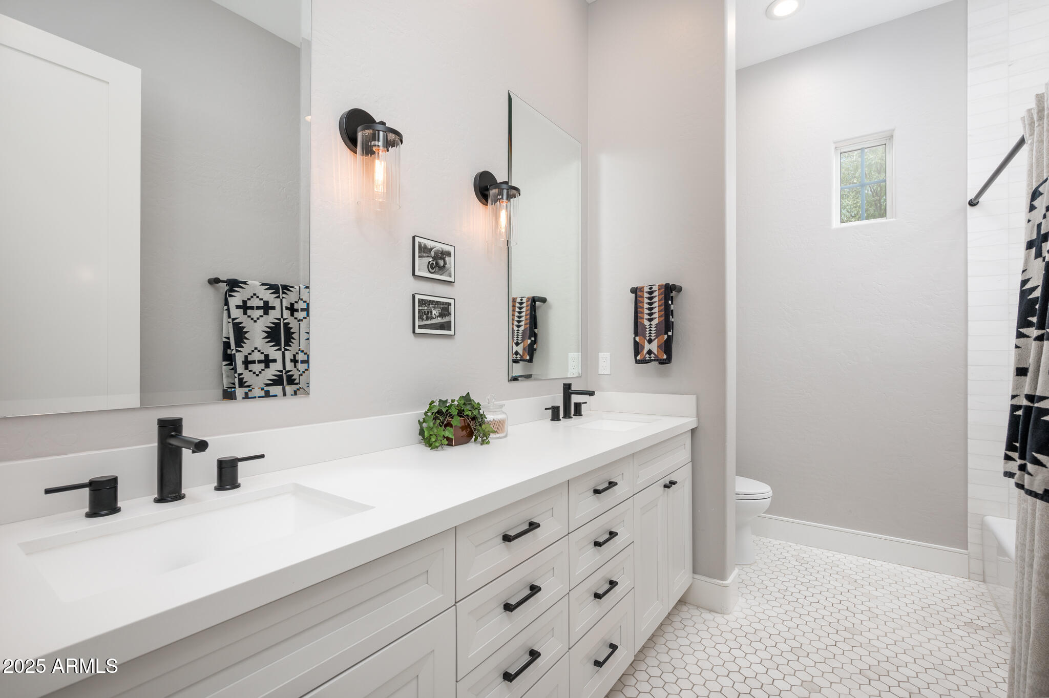 9631 East Mountain Spring Road Scottsdale, AZ 85255 - Photo 32 of 48 a bathroom with a sink and a mirror