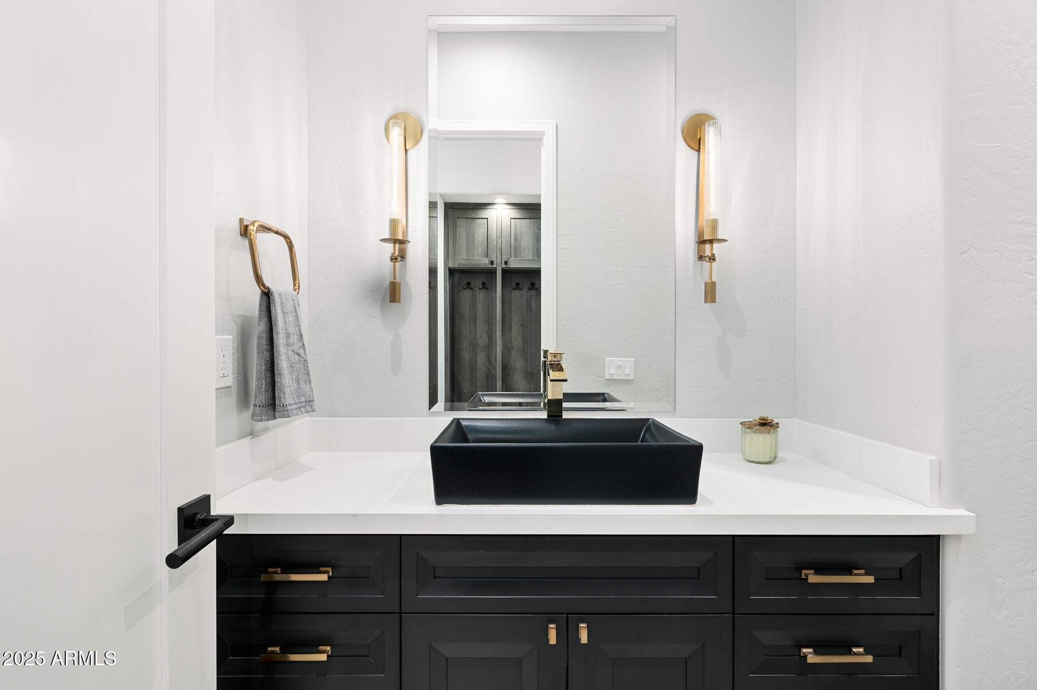 9631 East Mountain Spring Road Scottsdale, AZ 85255 - Photo 33 of 48 a bathroom with a sink and a mirror