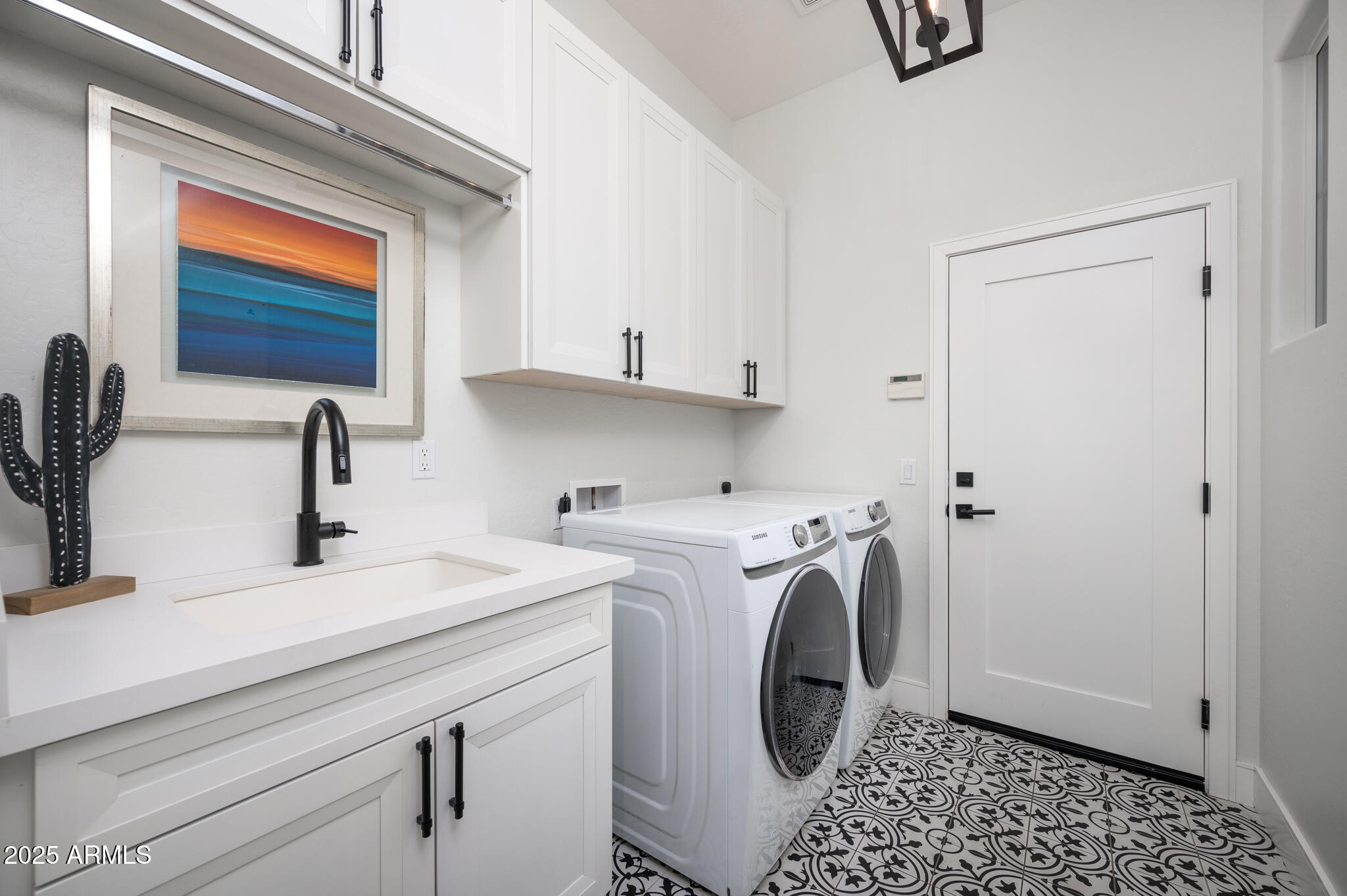 9631 East Mountain Spring Road Scottsdale, AZ 85255 - Photo 34 of 48 a view of a sink and washer dryer