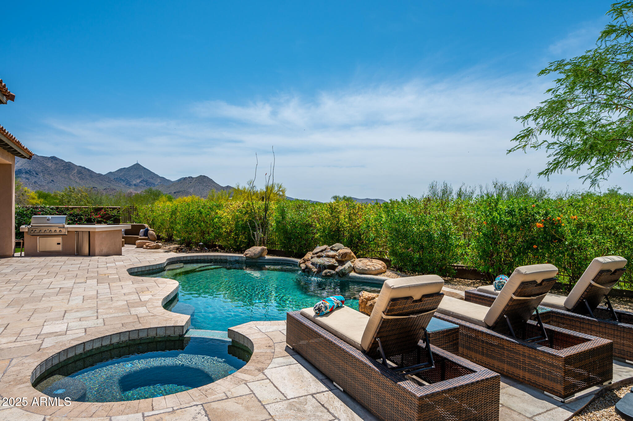 9631 East Mountain Spring Road Scottsdale, AZ 85255 - Photo 35 of 48 a view of a chairs and table in backyard