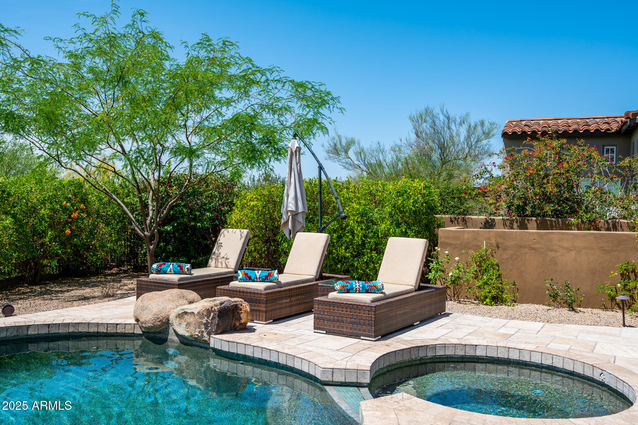 9631 East Mountain Spring Road Scottsdale, AZ 85255 - Photo 37 of 48 a view of swimming pool with lawn chairs and couches