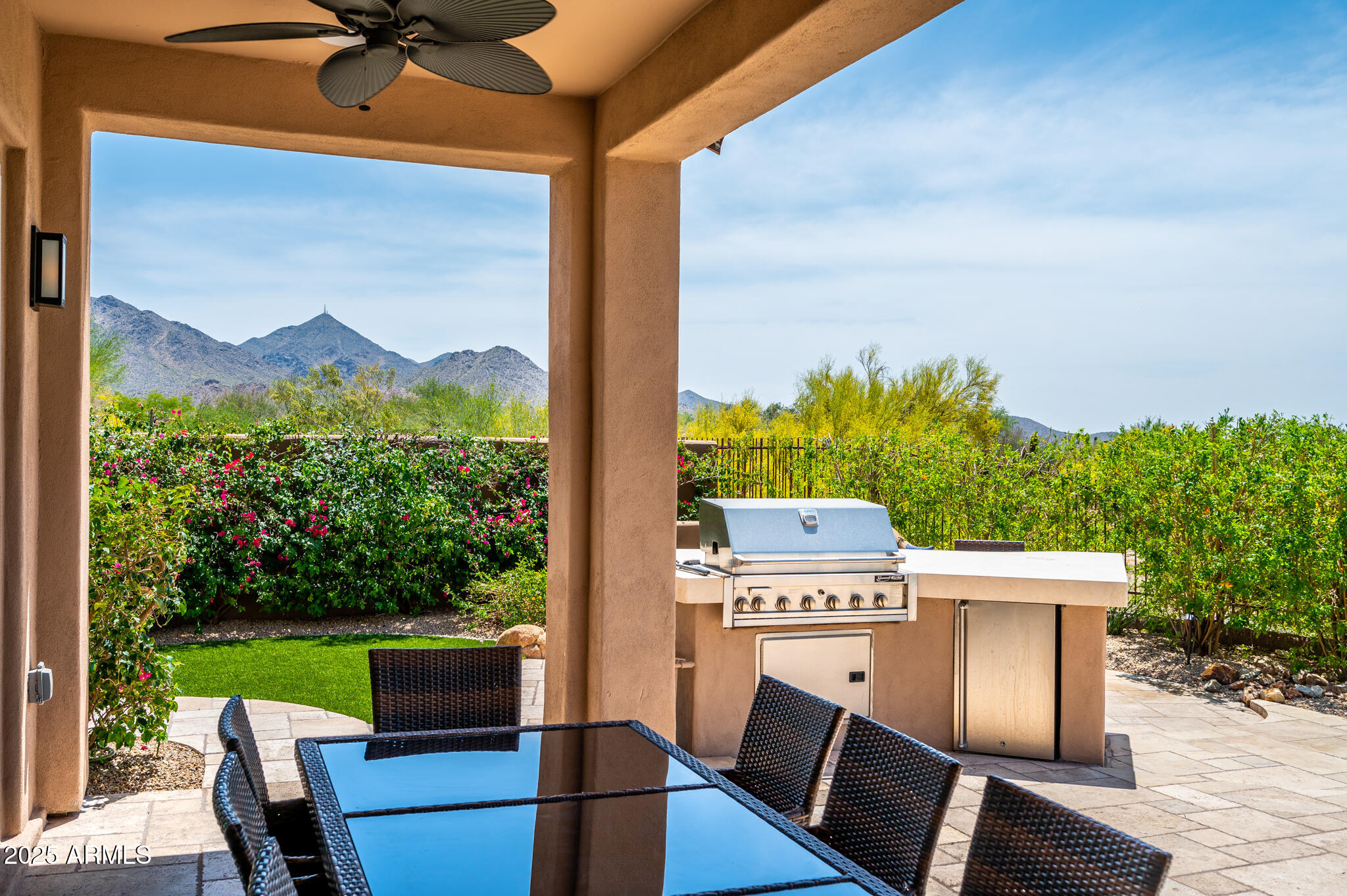 9631 East Mountain Spring Road Scottsdale, AZ 85255 - Photo 39 of 48 a view of a porch with furniture and a yard