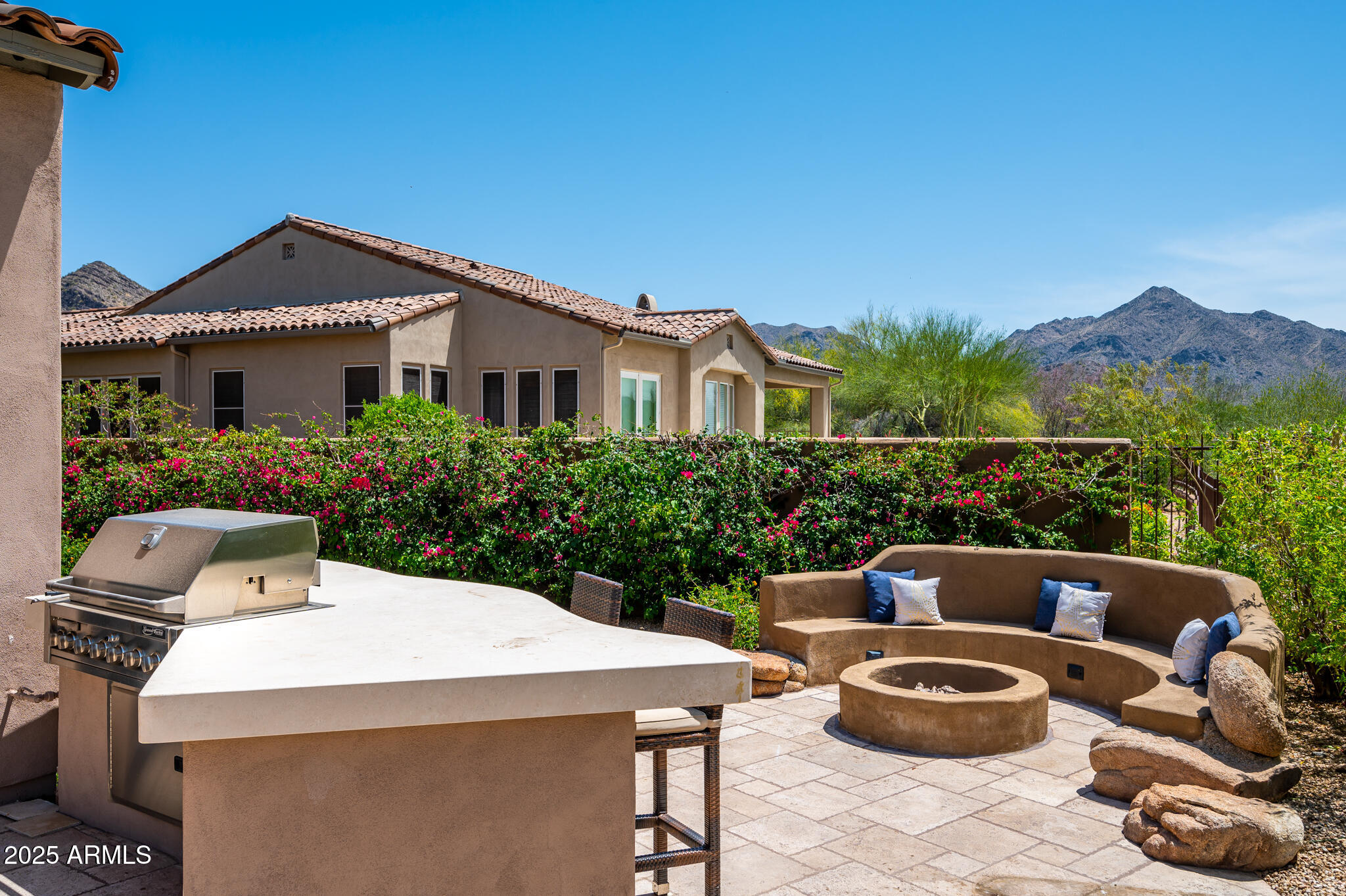 9631 East Mountain Spring Road Scottsdale, AZ 85255 - Photo 40 of 48 a view of a patio with couches table and chairs and potted plants