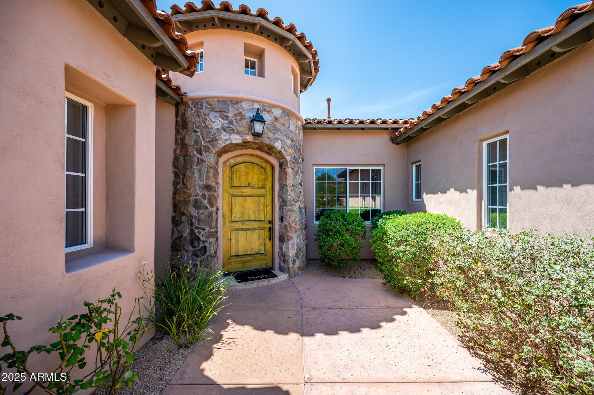 9631 East Mountain Spring Road Scottsdale, AZ 85255 - Photo 4 of 48 a front view of a house with garden