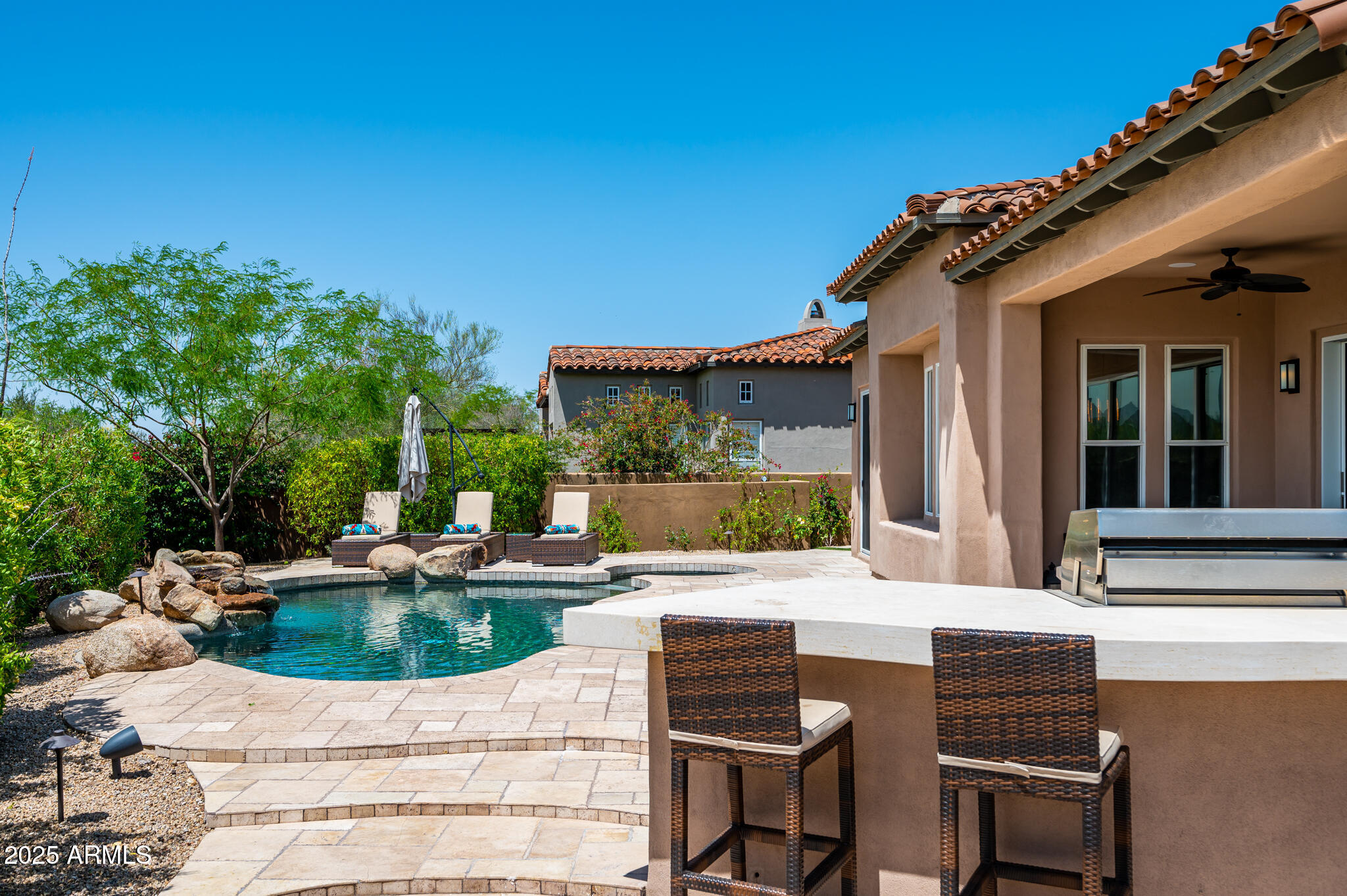 9631 East Mountain Spring Road Scottsdale, AZ 85255 - Photo 42 of 48 a view of a house with backyard sitting area and seating space