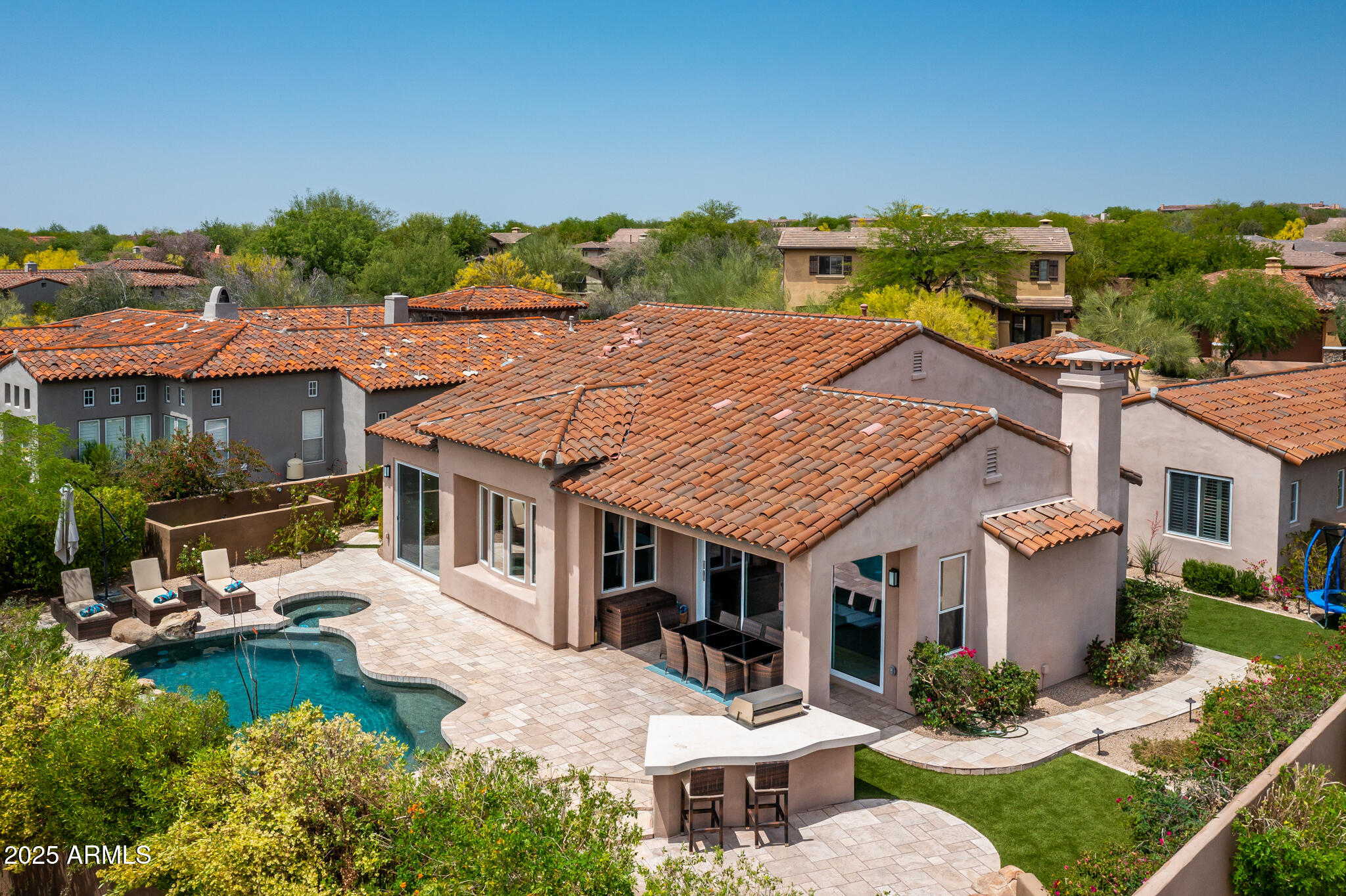 9631 East Mountain Spring Road Scottsdale, AZ 85255 - Photo 45 of 48 an aerial view of a house with swimming pool garden and patio