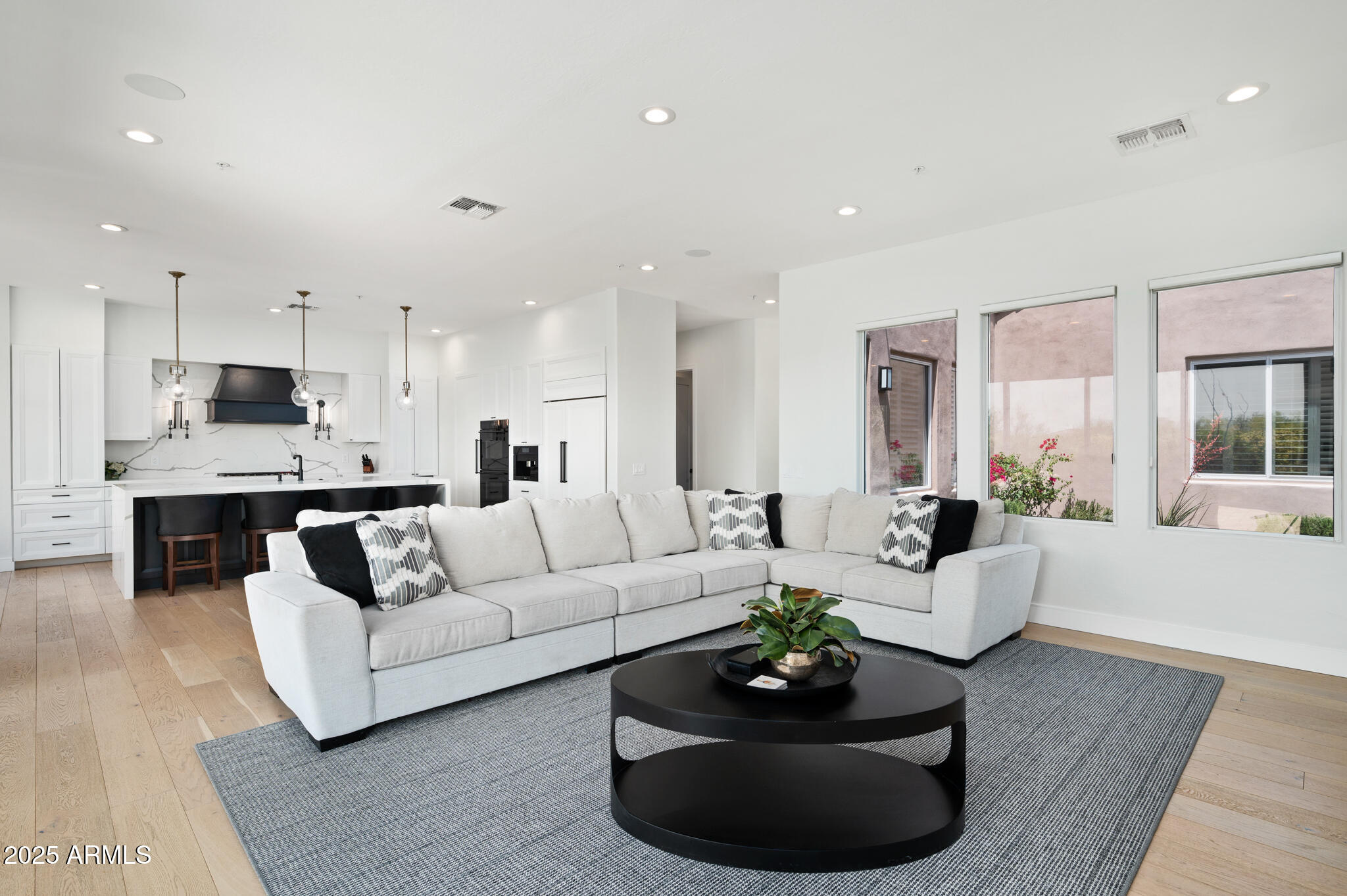 9631 East Mountain Spring Road Scottsdale, AZ 85255 - Photo 6 of 48 a living room with furniture and a large window