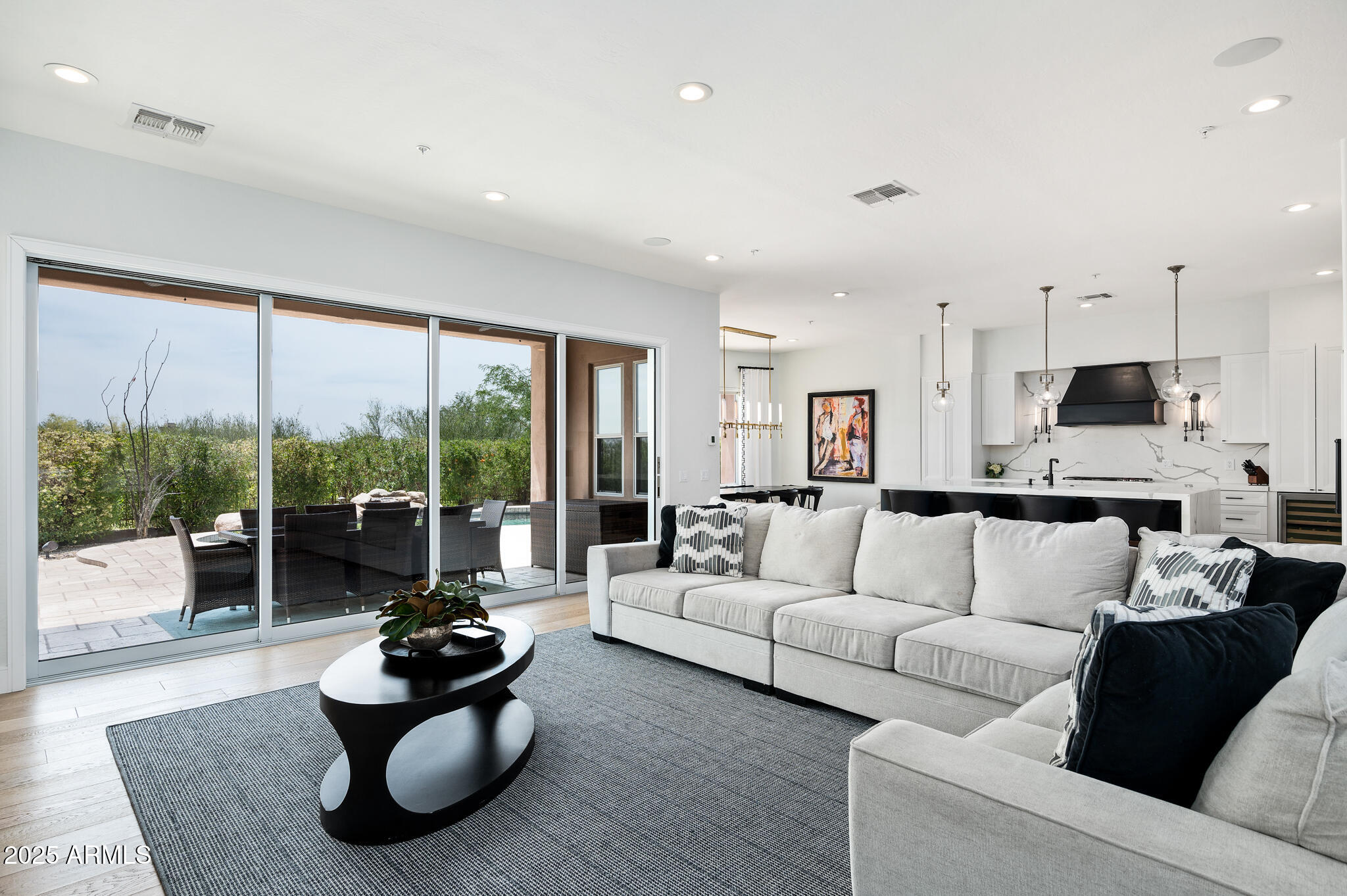 9631 East Mountain Spring Road Scottsdale, AZ 85255 - Photo 7 of 48 a living room with furniture and a large window