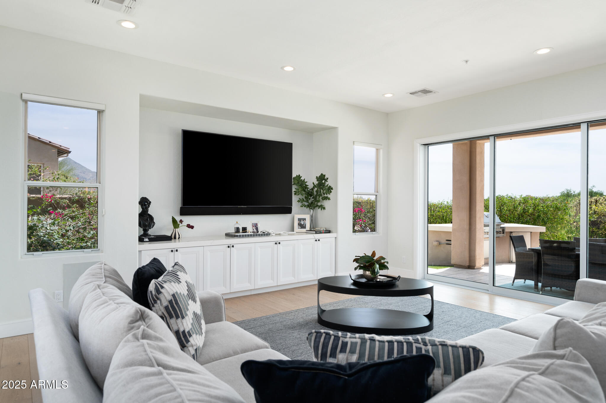 9631 East Mountain Spring Road Scottsdale, AZ 85255 - Photo 8 of 48 a living room with furniture and a flat screen tv