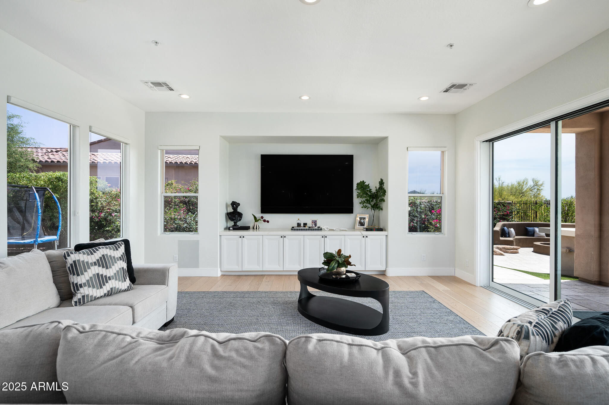 9631 East Mountain Spring Road Scottsdale, AZ 85255 - Photo 9 of 48 a living room with furniture and a flat screen tv