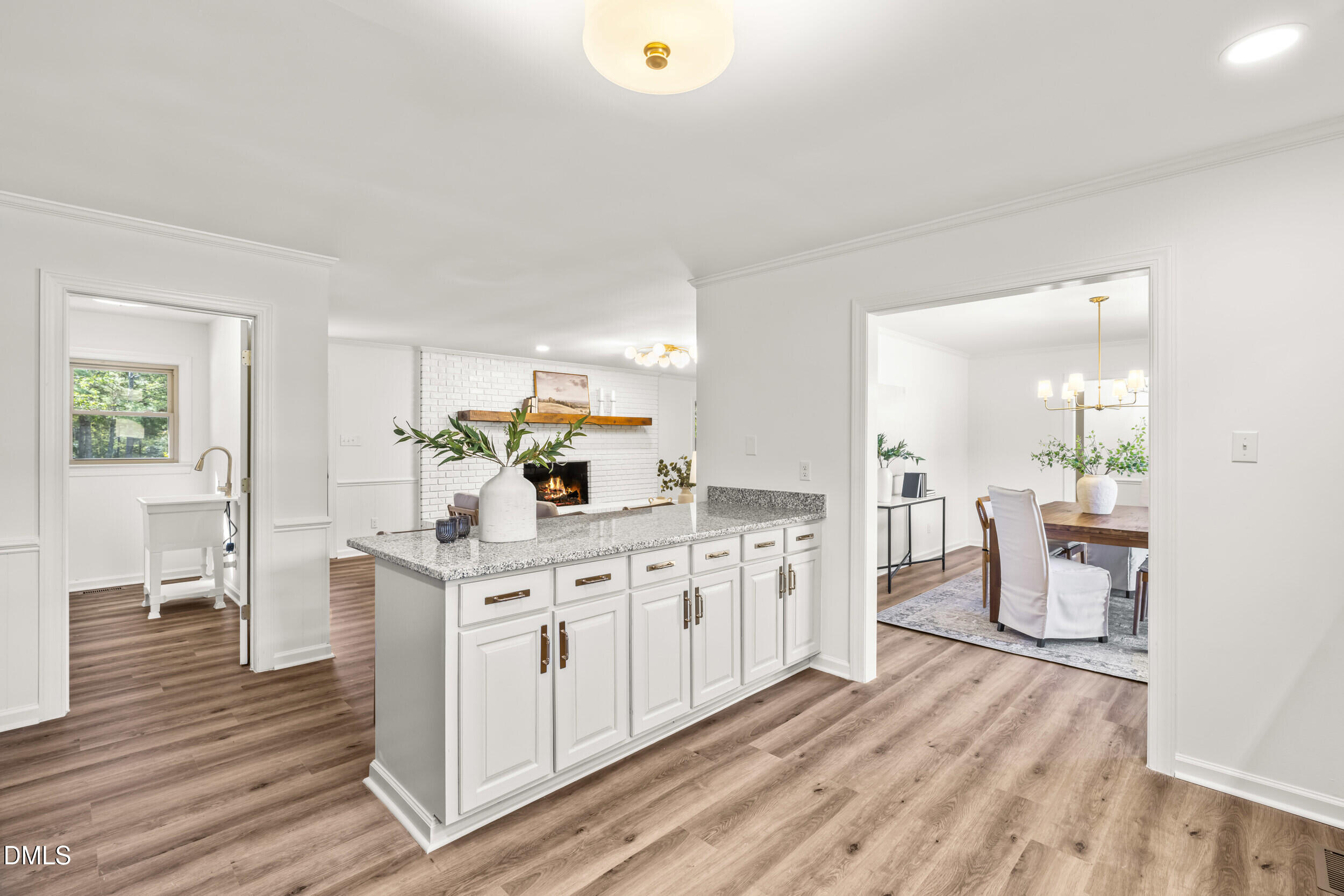 462 Sullivan Road Selma, NC 27576 - Photo 19 of 33 a kitchen with white cabinets and sink