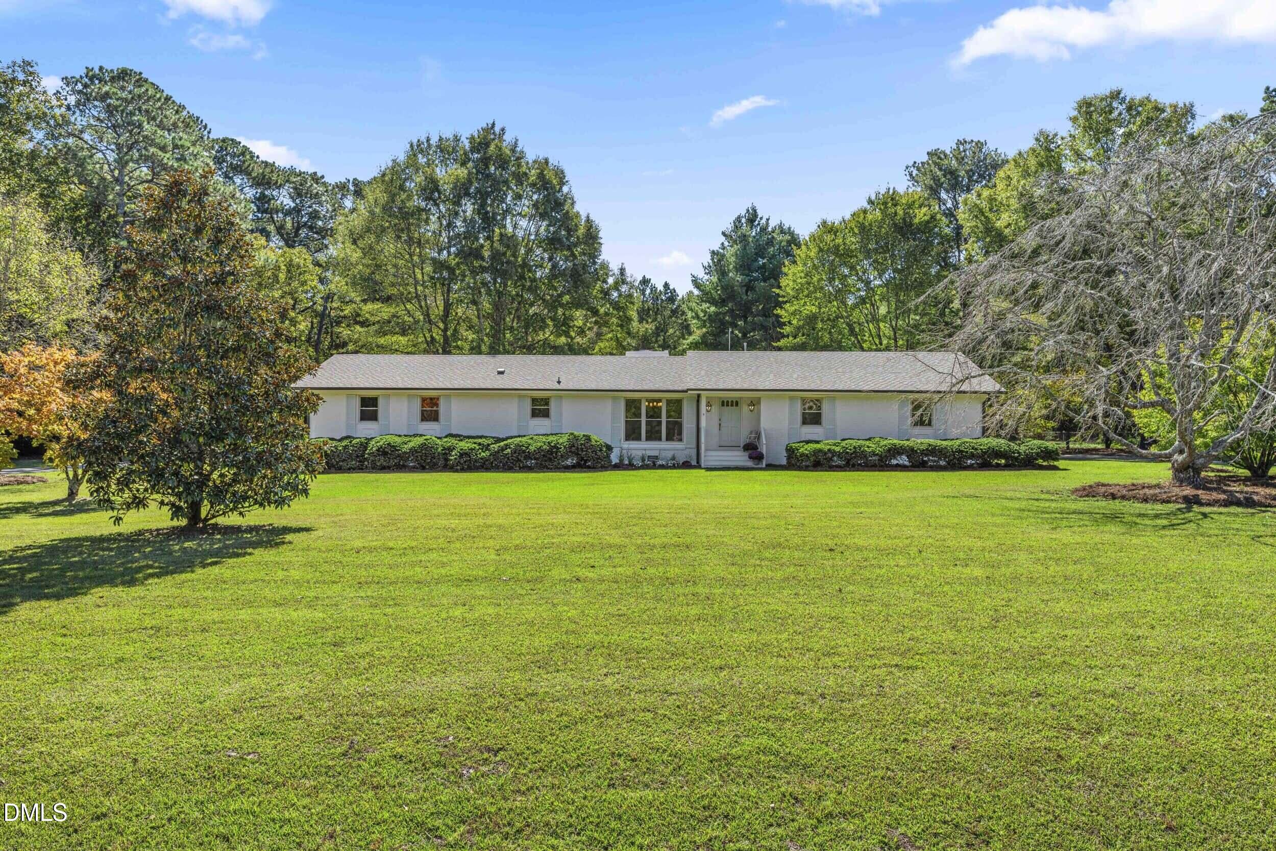 462 Sullivan Road Selma, NC 27576 - Photo 2 of 33 a front view of house with a garden