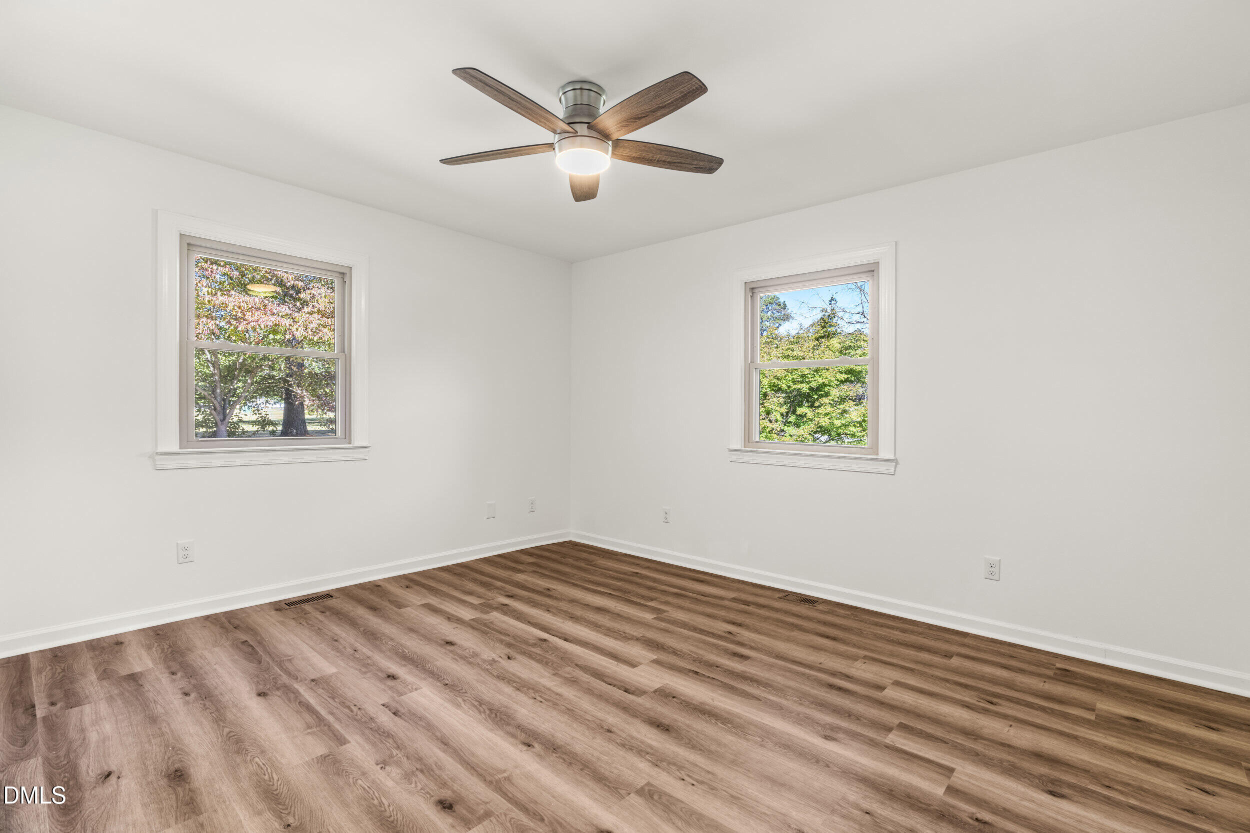 462 Sullivan Road Selma, NC 27576 - Photo 24 of 33 a view of empty room with wooden floor