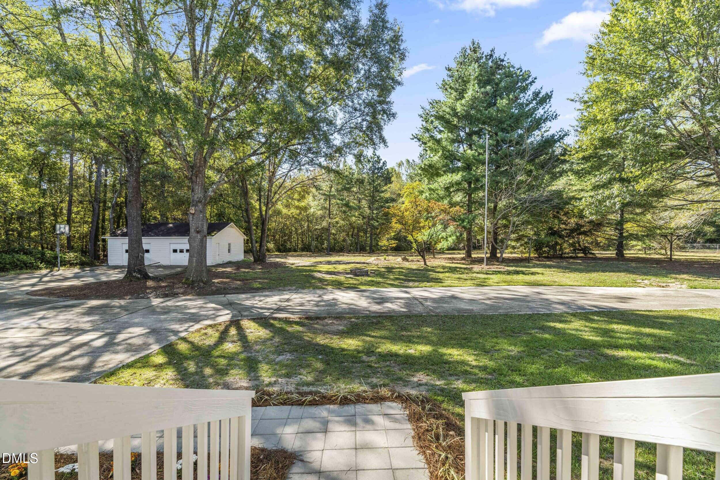 462 Sullivan Road Selma, NC 27576 - Photo 28 of 33 a view of a yard with large trees
