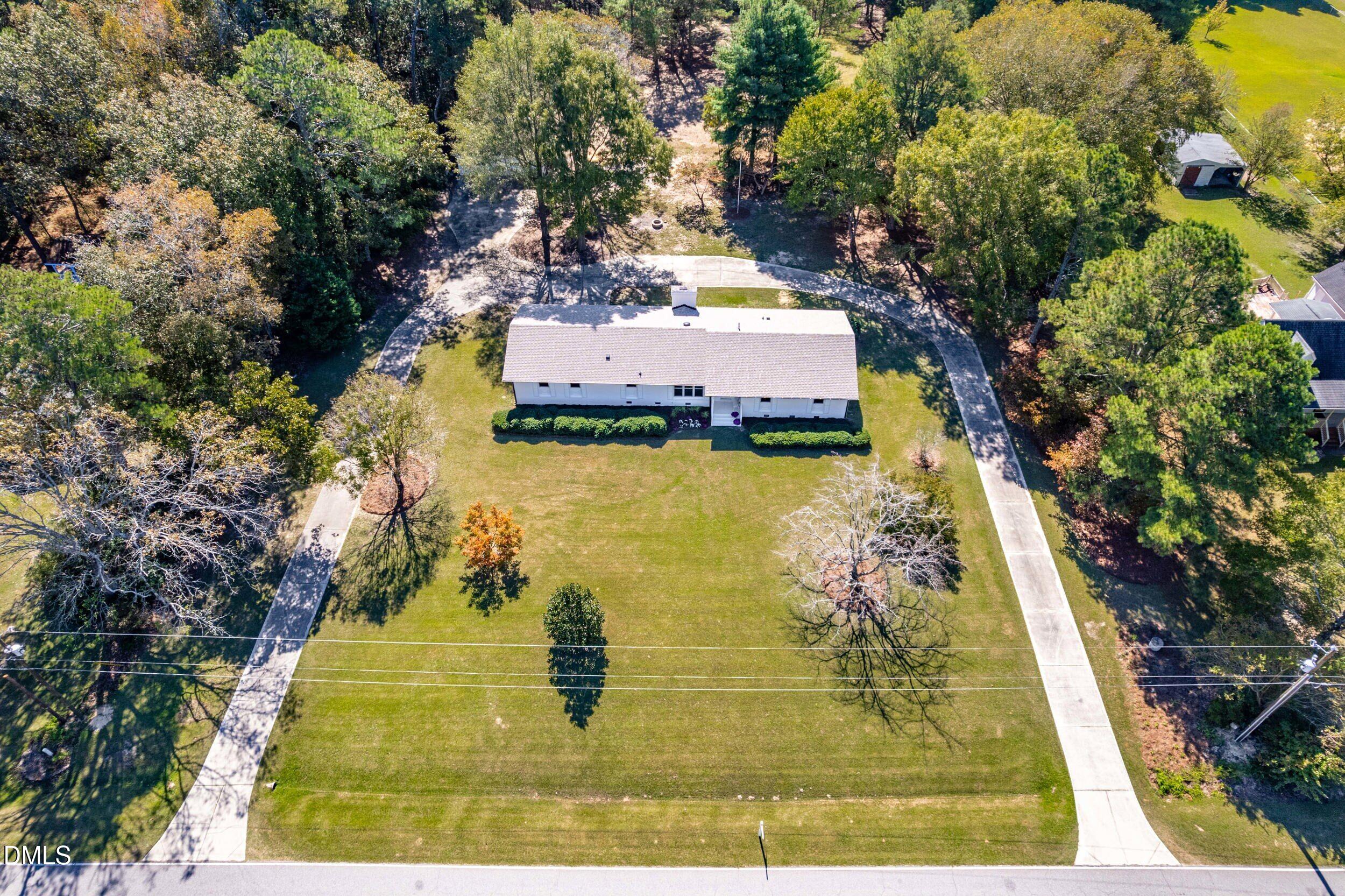 462 Sullivan Road Selma, NC 27576 - Photo 3 of 33 an aerial view of residential houses with outdoor space