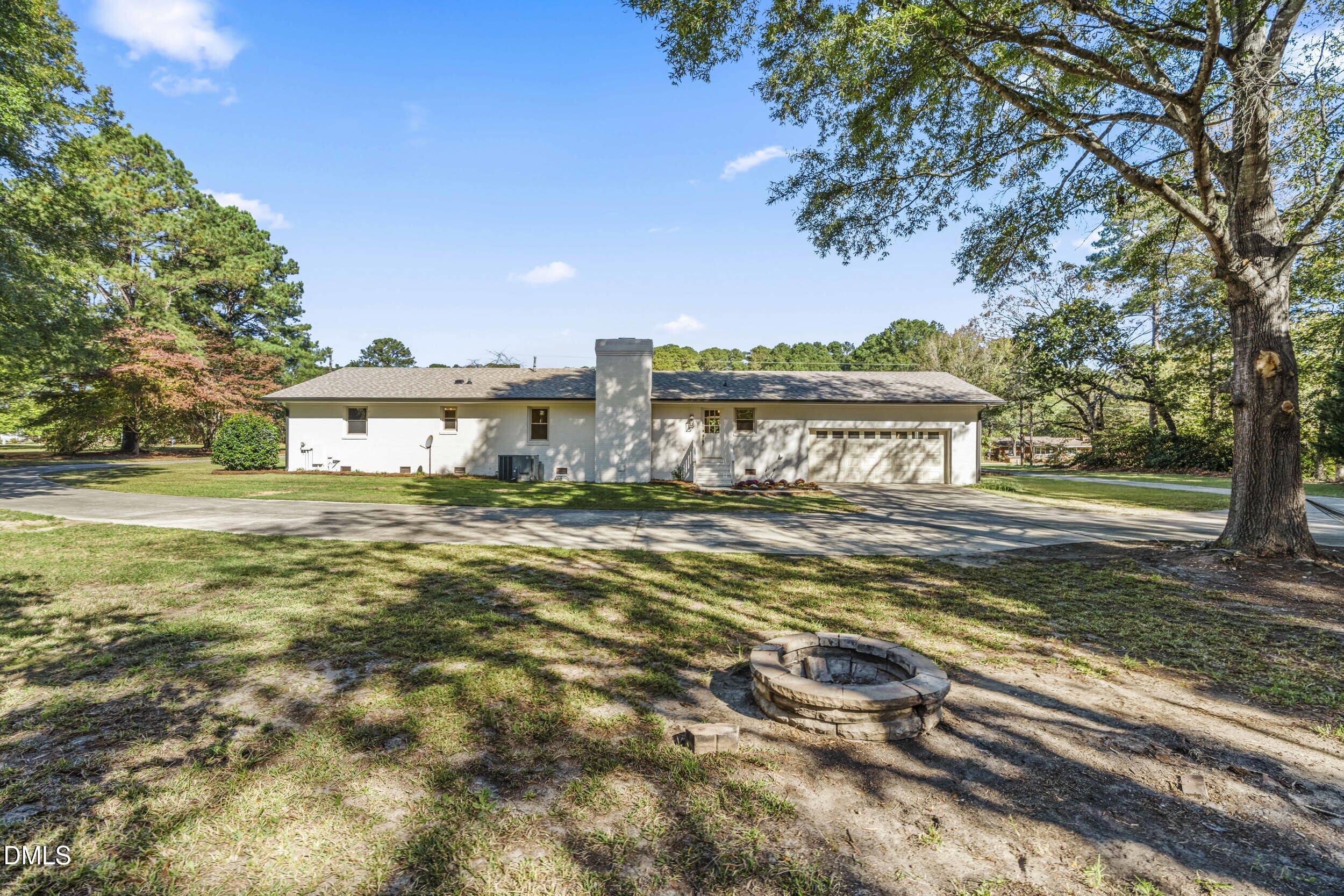 462 Sullivan Road Selma, NC 27576 - Photo 31 of 33 a view of a house with a yard