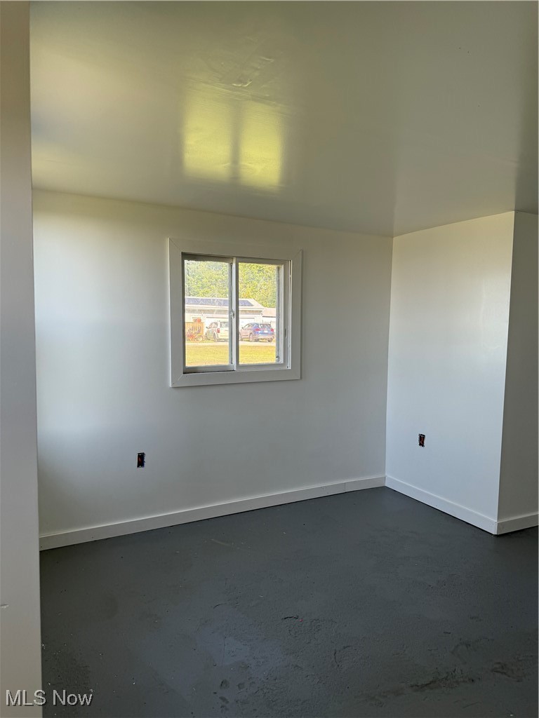 4394 Lake Road East Geneva, OH 44041 - Photo 7 of 13 Unfurnished room with concrete floors