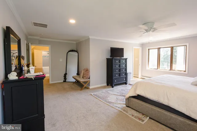 a bed room with a bed and a television