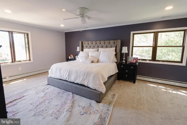 a bedroom with a large bed and a window