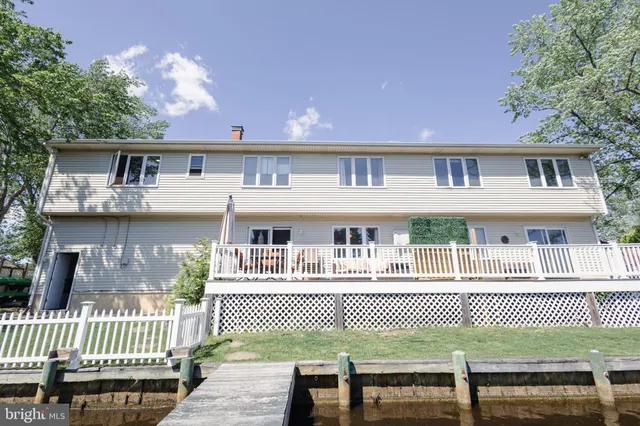 a front view of a house with a bench