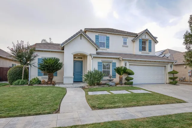 an empty room with a fireplace and cabinet