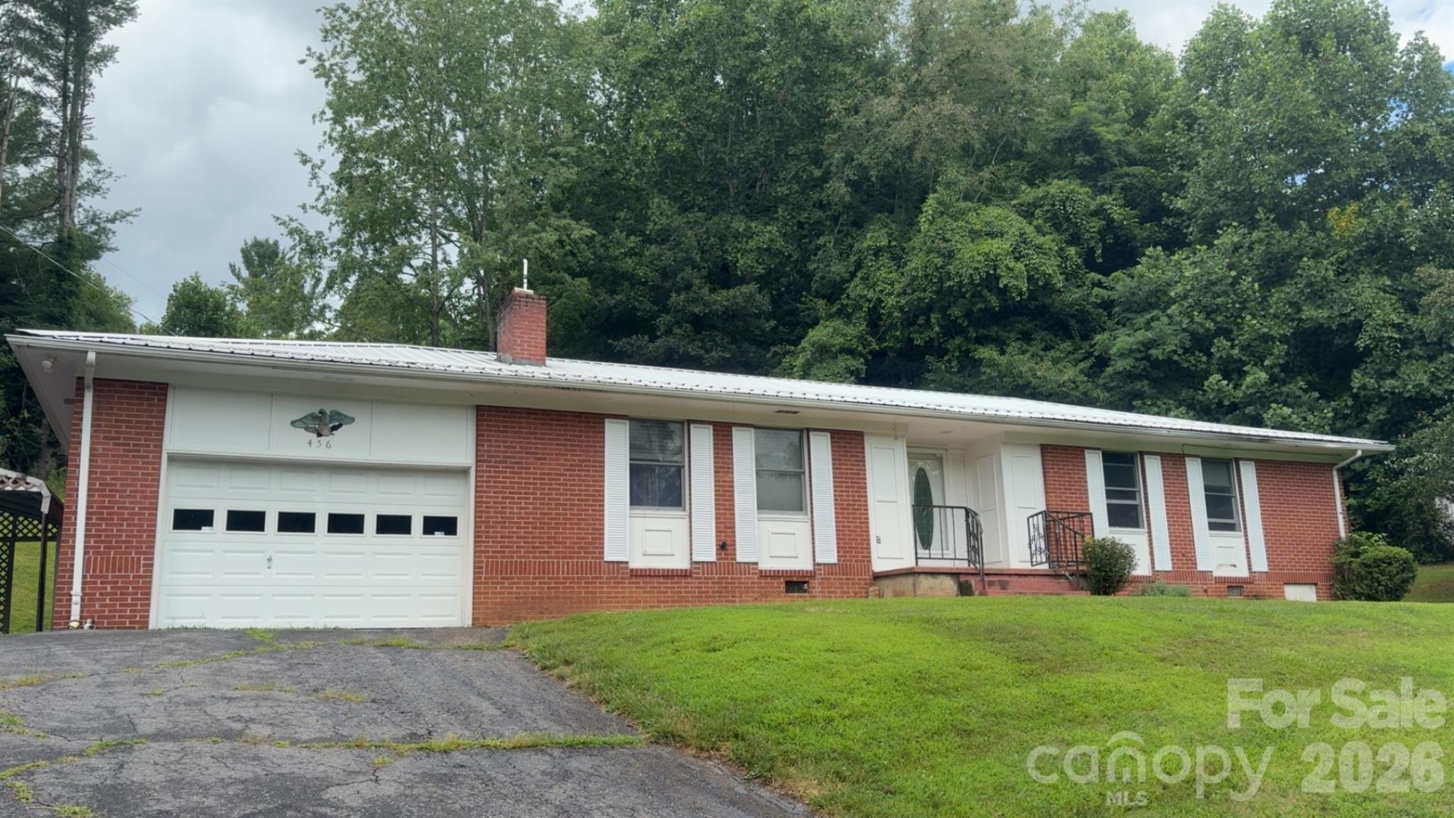 front view of a house with a yard