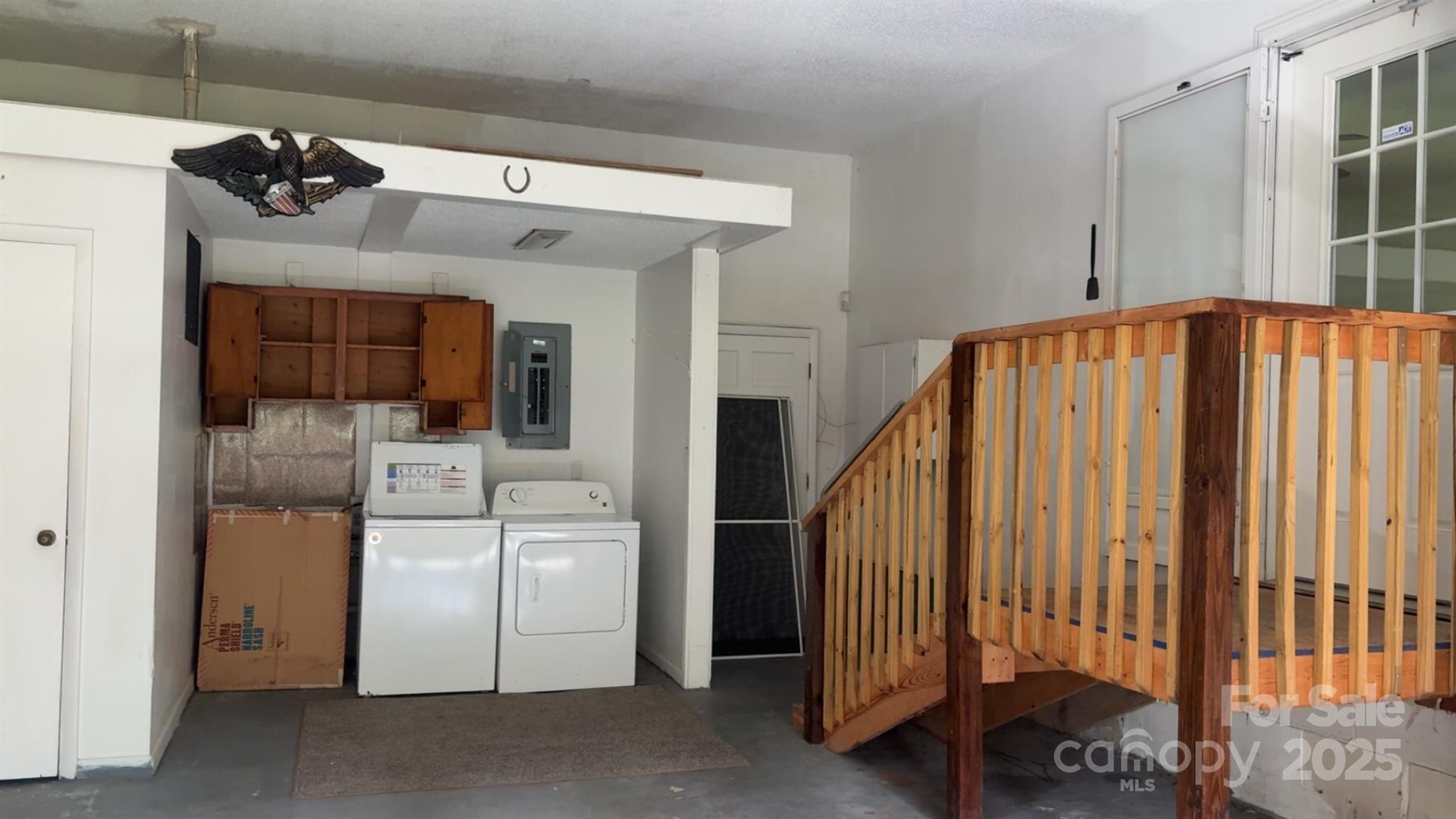 456 Duck Branch Road Bakersville, NC 28705 - Photo 11 of 19 a view of a hallway with entryway and chandelier