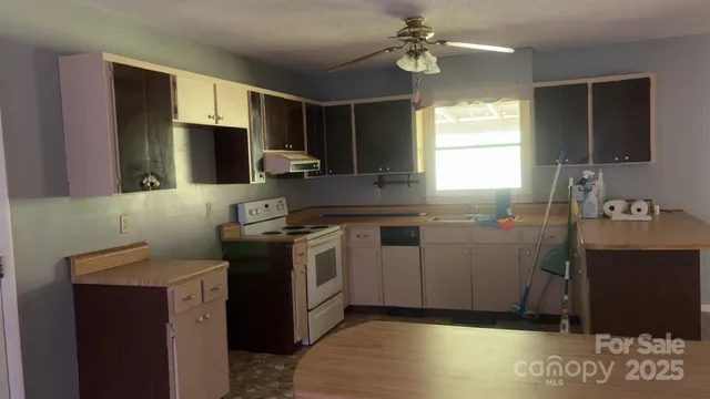 a kitchen with a stove and a sink