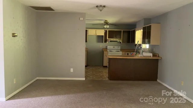 a kitchen with stainless steel appliances a sink stove and refrigerator