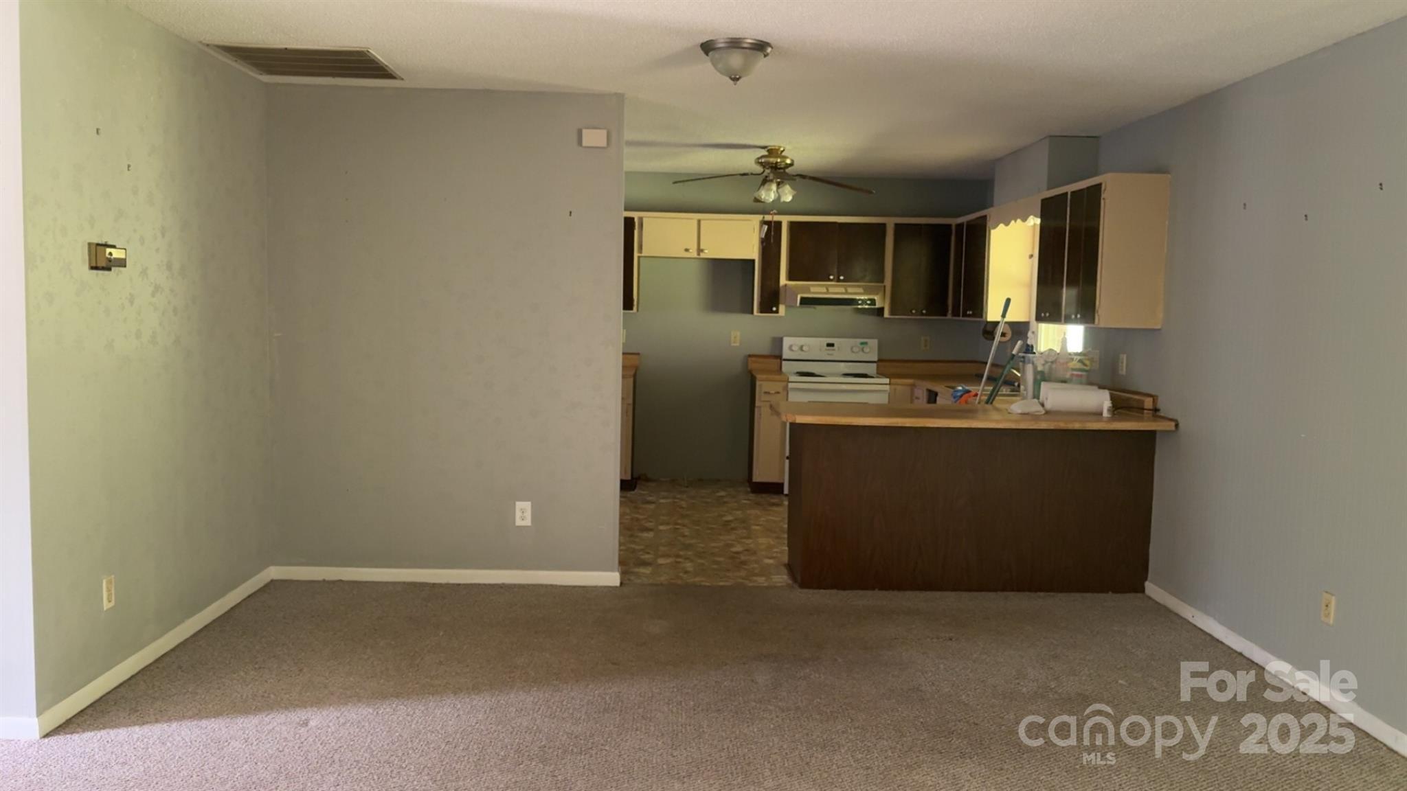 456 Duck Branch Road Bakersville, NC 28705 - Photo 18 of 19 a kitchen with stainless steel appliances a sink stove and refrigerator