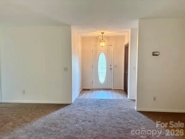 an empty room with mirror