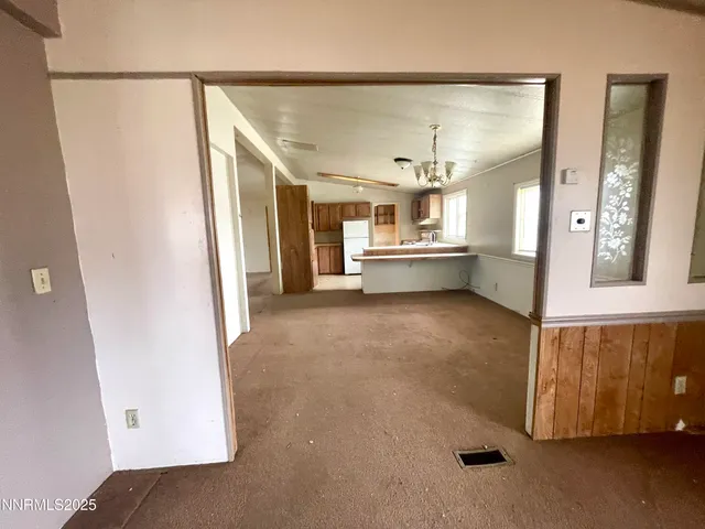 a very nice looking room with a wooden floor and a bathroom