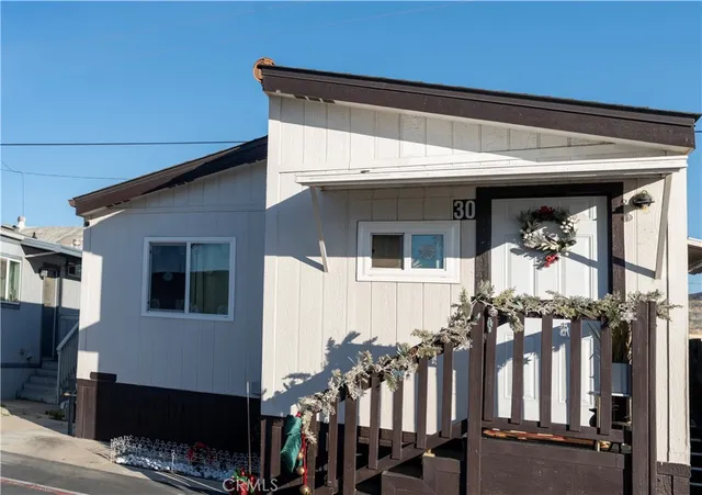 a front view of a house with glass windows