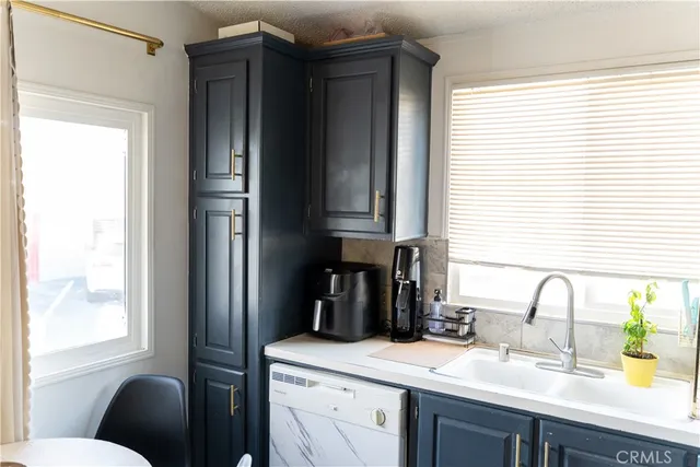 a kitchen with a sink and a window