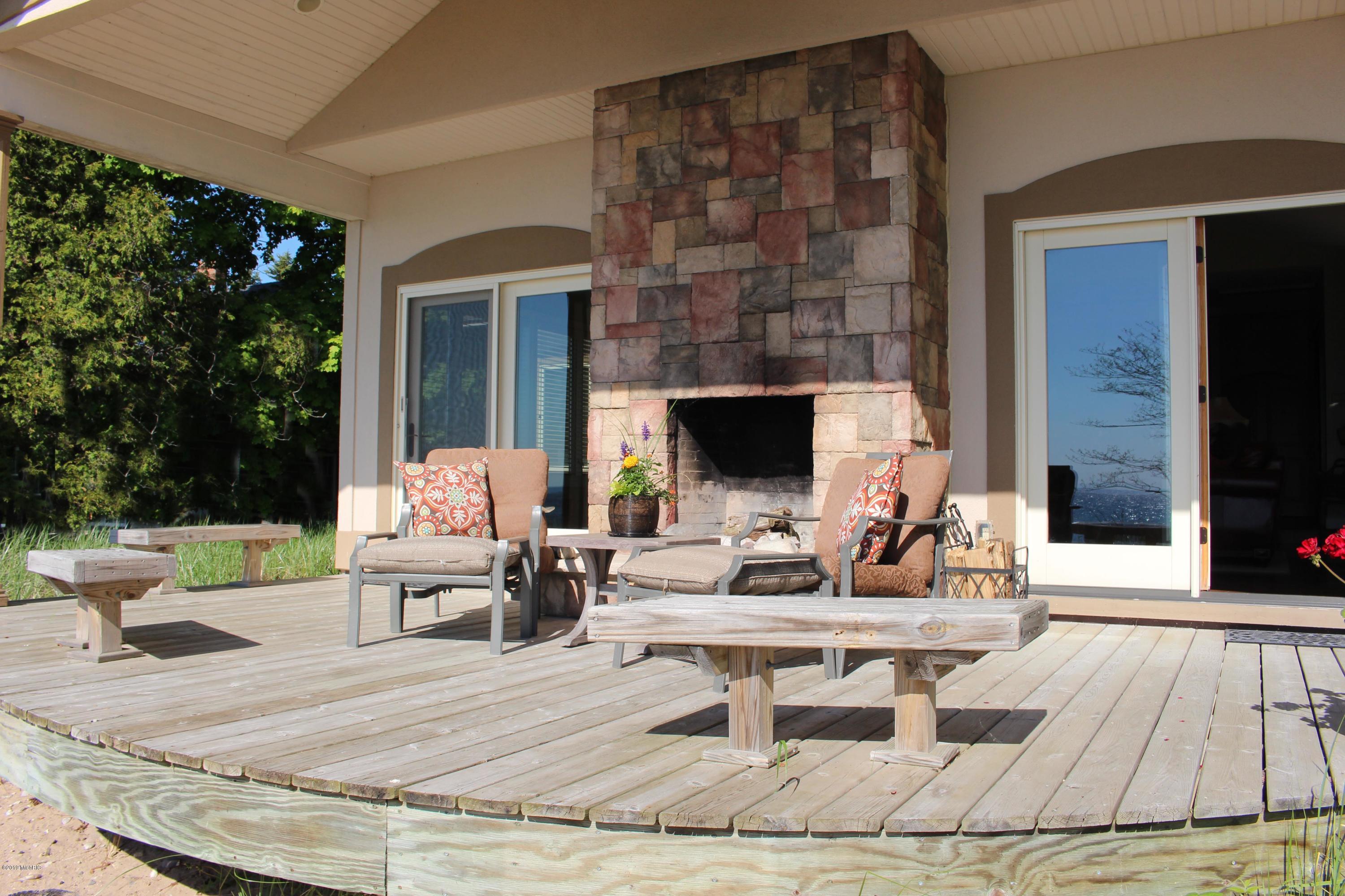 3062 Lakeshore Road Manistee, MI 49660 - Photo 1 of 63 Front Deck & Fireplace