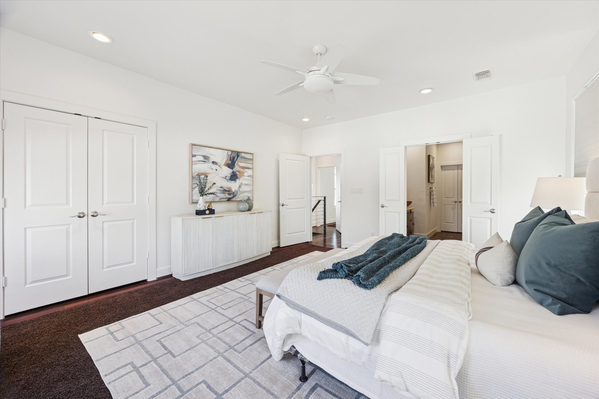 1821 West Main Street, Unit A Houston, TX 77098 - Photo 7 of 12 Another view of the expansive primary bedroom highlighting generous proportions, seamless flow to the en-suite bath, and serene finishes.