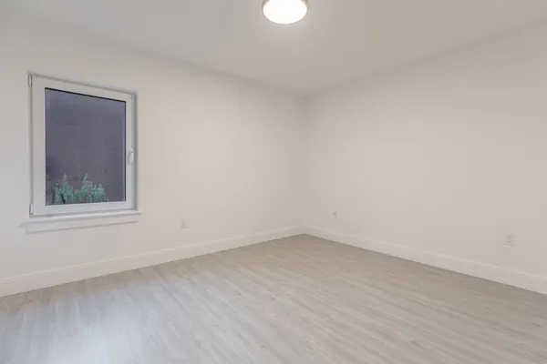 a view of an empty room with a window