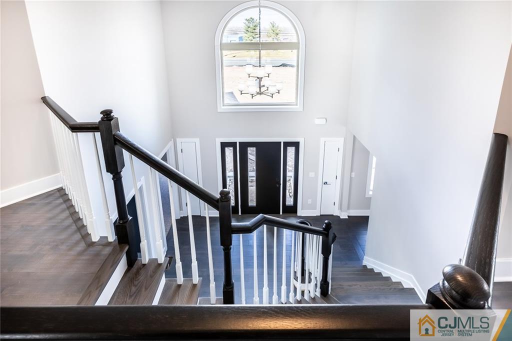 123 Millhurst Road Manalapan, NJ 07726 - Photo 1 of 27 a view of entryway and hall with wooden floor