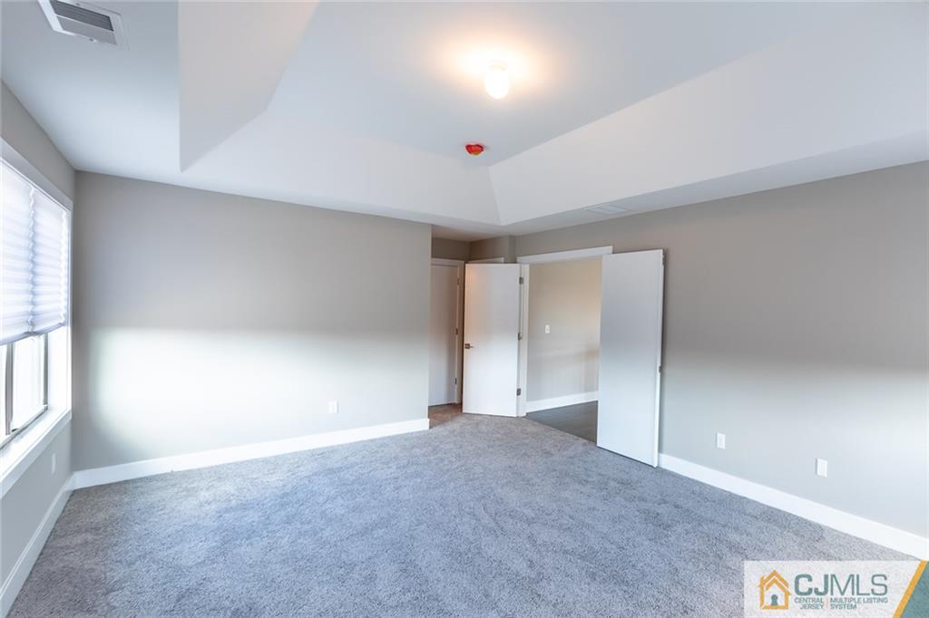 123 Millhurst Road Manalapan, NJ 07726 - Photo 12 of 27 a very nice looking room with a large window